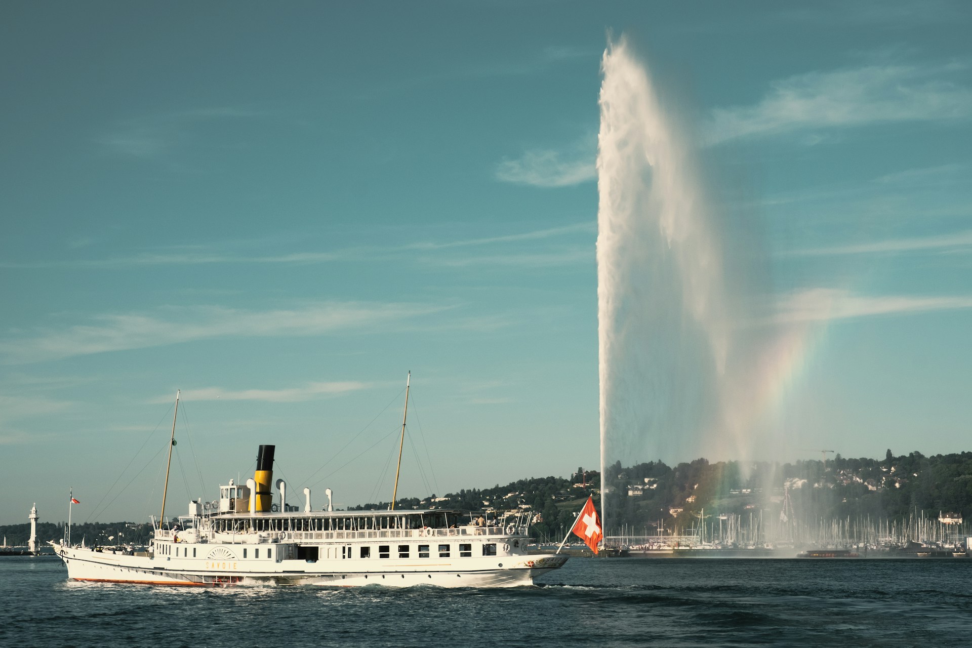 Geneva Jet d'Eau fountain on Lake Geneva with the Alps in the background